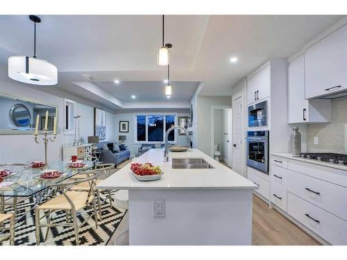 2-2633 1 Avenue Nw, Calgary, AB - Indoor Photo Showing Kitchen With Double Sink With Upgraded Kitchen