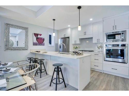 1-2633 1 Avenue Nw, Calgary, AB - Indoor Photo Showing Kitchen With Upgraded Kitchen