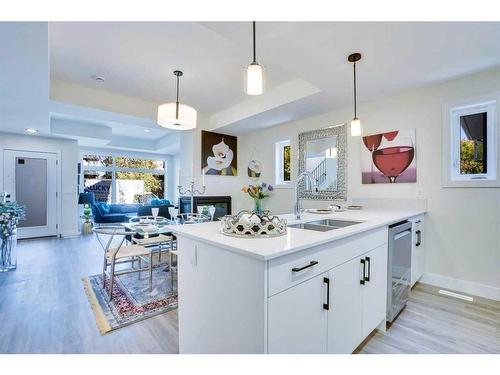 1-2633 1 Avenue Nw, Calgary, AB - Indoor Photo Showing Kitchen With Double Sink