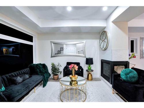 1-2633 1 Avenue Nw, Calgary, AB - Indoor Photo Showing Living Room With Fireplace