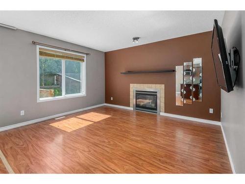 81 Royal Elm Road Nw, Calgary, AB - Indoor Photo Showing Living Room With Fireplace