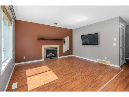 81 Royal Elm Road Nw, Calgary, AB - Indoor Photo Showing Living Room With Fireplace