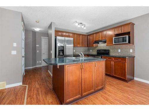 81 Royal Elm Road Nw, Calgary, AB - Indoor Photo Showing Kitchen With Double Sink