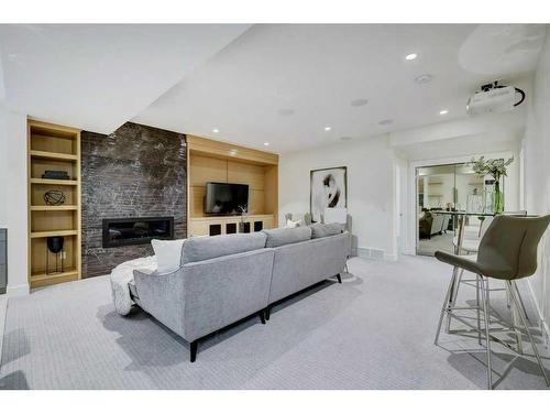 120 25 Avenue Nw, Calgary, AB - Indoor Photo Showing Living Room With Fireplace