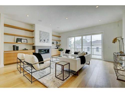 120 25 Avenue Nw, Calgary, AB - Indoor Photo Showing Living Room With Fireplace