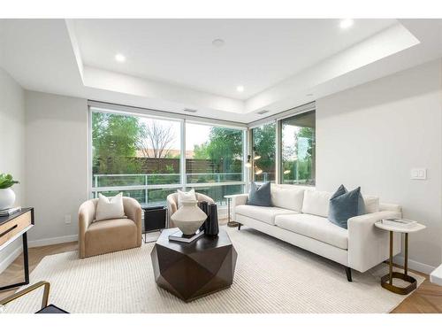 108-8445 Broadcast Avenue Sw, Calgary, AB - Indoor Photo Showing Living Room