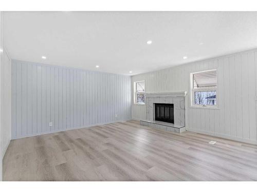 80 Scanlon Place Nw, Calgary, AB - Indoor Photo Showing Living Room With Fireplace