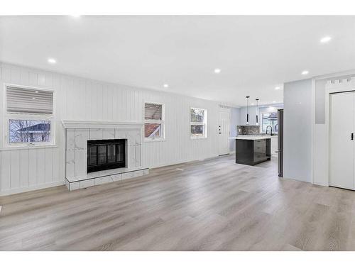 80 Scanlon Place Nw, Calgary, AB - Indoor Photo Showing Living Room With Fireplace