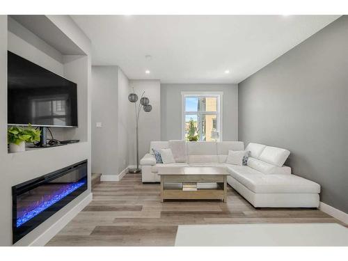 53 Spring Willow Close Sw, Calgary, AB - Indoor Photo Showing Living Room With Fireplace