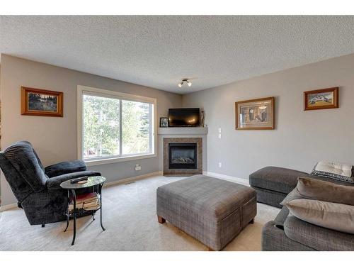 219-371 Marina Drive, Chestermere, AB - Indoor Photo Showing Living Room With Fireplace