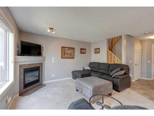 219-371 Marina Drive, Chestermere, AB - Indoor Photo Showing Living Room With Fireplace