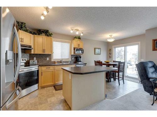 219-371 Marina Drive, Chestermere, AB - Indoor Photo Showing Kitchen With Double Sink