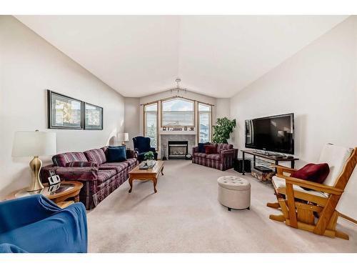 127 Invermere Close, Chestermere, AB - Indoor Photo Showing Living Room With Fireplace