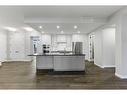 201-120 Marina Cove Se, Calgary, AB  - Indoor Photo Showing Kitchen With Upgraded Kitchen 