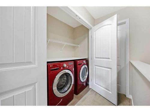 84 New Brighton Grove Se, Calgary, AB - Indoor Photo Showing Laundry Room