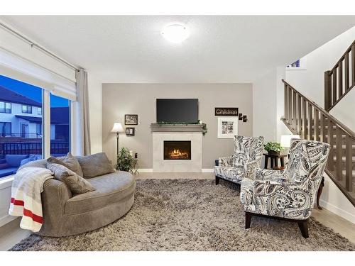 186 Coopersfield Way Sw, Airdrie, AB - Indoor Photo Showing Living Room With Fireplace