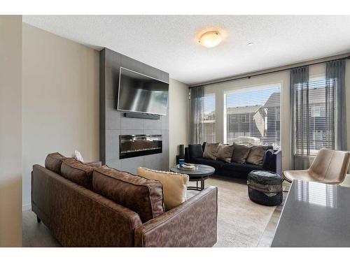 14 Howse Mount Ne, Calgary, AB - Indoor Photo Showing Living Room With Fireplace