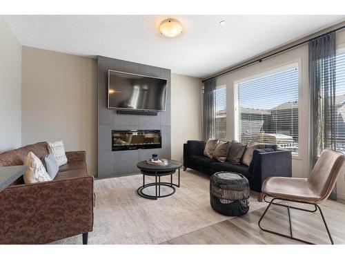 14 Howse Mount Ne, Calgary, AB - Indoor Photo Showing Living Room With Fireplace