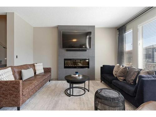 14 Howse Mount Ne, Calgary, AB - Indoor Photo Showing Living Room With Fireplace