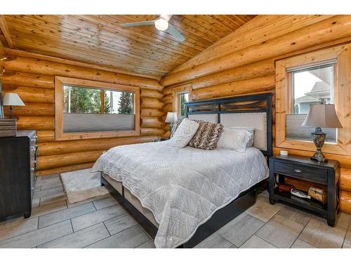 416 Ghost Lake Village Road, Ghost Lake, AB - Indoor Photo Showing Bedroom With Fireplace