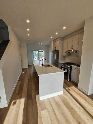 8820-8850 48 Street Ne, Calgary, AB - Indoor Photo Showing Kitchen With Stainless Steel Kitchen With Double Sink With Upgraded Kitchen