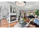 606-205 Riverfront Avenue Sw, Calgary, AB  - Indoor Photo Showing Living Room With Fireplace 