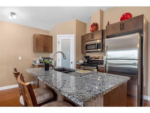 12202-2781 Chinook Winds Drive Sw, Airdrie, AB - Indoor Photo Showing Kitchen With Stainless Steel Kitchen With Double Sink With Upgraded Kitchen