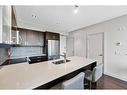 406-805 4 Street Ne, Calgary, AB  - Indoor Photo Showing Kitchen With Stainless Steel Kitchen With Double Sink With Upgraded Kitchen 