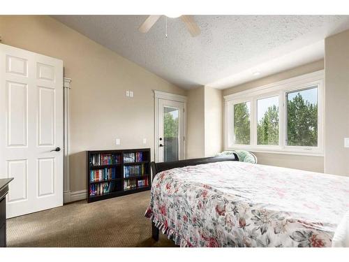 16 Wolfwillow Lane, Rural Rocky View County, AB - Indoor Photo Showing Bedroom