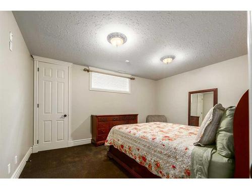 16 Wolfwillow Lane, Rural Rocky View County, AB - Indoor Photo Showing Bedroom