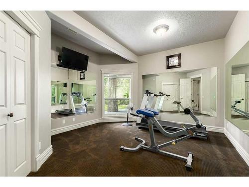 16 Wolfwillow Lane, Rural Rocky View County, AB - Indoor Photo Showing Gym Room