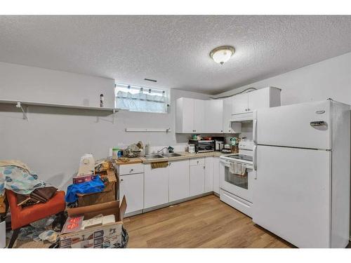 228 Martinvalley Crescent Ne, Calgary, AB - Indoor Photo Showing Kitchen With Double Sink