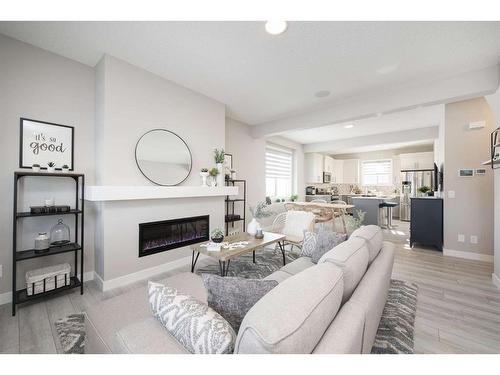 706 Wolf Willow Boulevard Se, Calgary, AB - Indoor Photo Showing Living Room With Fireplace