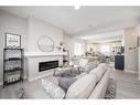 706 Wolf Willow Boulevard Se, Calgary, AB  - Indoor Photo Showing Living Room With Fireplace 