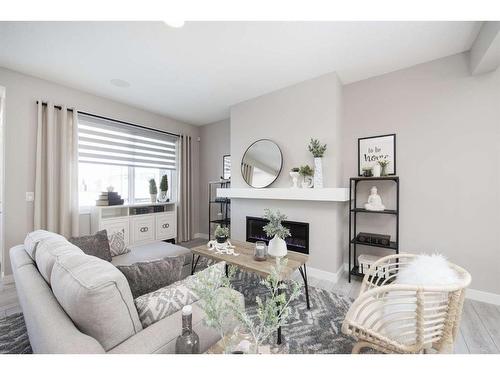 706 Wolf Willow Boulevard Se, Calgary, AB - Indoor Photo Showing Living Room With Fireplace