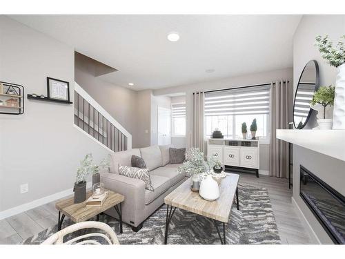 706 Wolf Willow Boulevard Se, Calgary, AB - Indoor Photo Showing Living Room With Fireplace