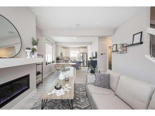 706 Wolf Willow Boulevard Se, Calgary, AB - Indoor Photo Showing Living Room With Fireplace