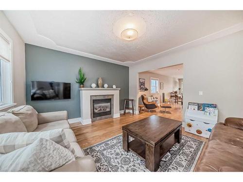 1728 Westmount Road Nw, Calgary, AB - Indoor Photo Showing Living Room With Fireplace