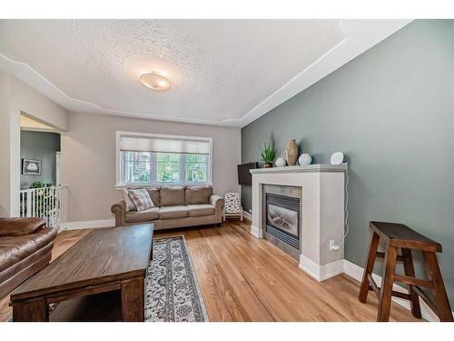 1728 Westmount Road Nw, Calgary, AB - Indoor Photo Showing Living Room With Fireplace