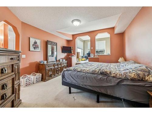 140 Arbour Butte Road Nw, Calgary, AB - Indoor Photo Showing Bedroom