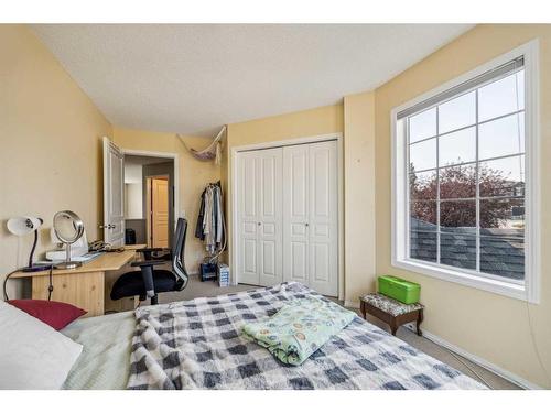 140 Arbour Butte Road Nw, Calgary, AB - Indoor Photo Showing Bedroom