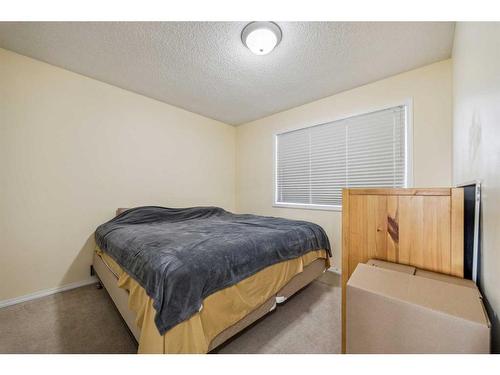 140 Arbour Butte Road Nw, Calgary, AB - Indoor Photo Showing Bedroom