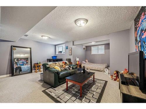 140 Arbour Butte Road Nw, Calgary, AB - Indoor Photo Showing Living Room