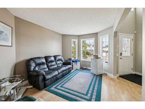 140 Arbour Butte Road Nw, Calgary, AB - Indoor Photo Showing Living Room