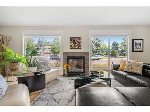 1108 Lake Placid Drive Se, Calgary, AB - Indoor Photo Showing Living Room With Fireplace