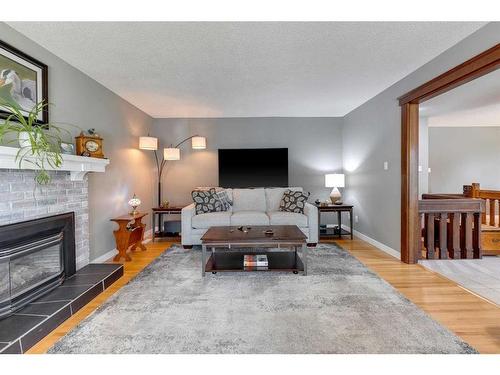 20 Lake Linnet Close Se, Calgary, AB - Indoor Photo Showing Living Room With Fireplace