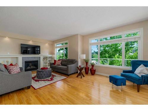 22 Discovery Woods Villas Sw, Calgary, AB - Indoor Photo Showing Living Room With Fireplace