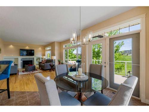 22 Discovery Woods Villas Sw, Calgary, AB - Indoor Photo Showing Living Room With Fireplace