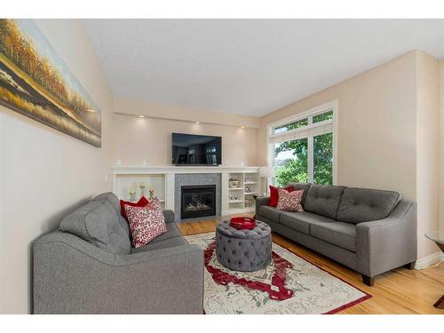 22 Discovery Woods Villas Sw, Calgary, AB - Indoor Photo Showing Living Room With Fireplace