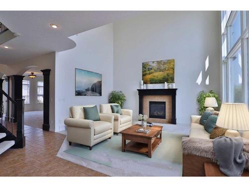 105 Hamptons Close Nw, Calgary, AB - Indoor Photo Showing Living Room With Fireplace